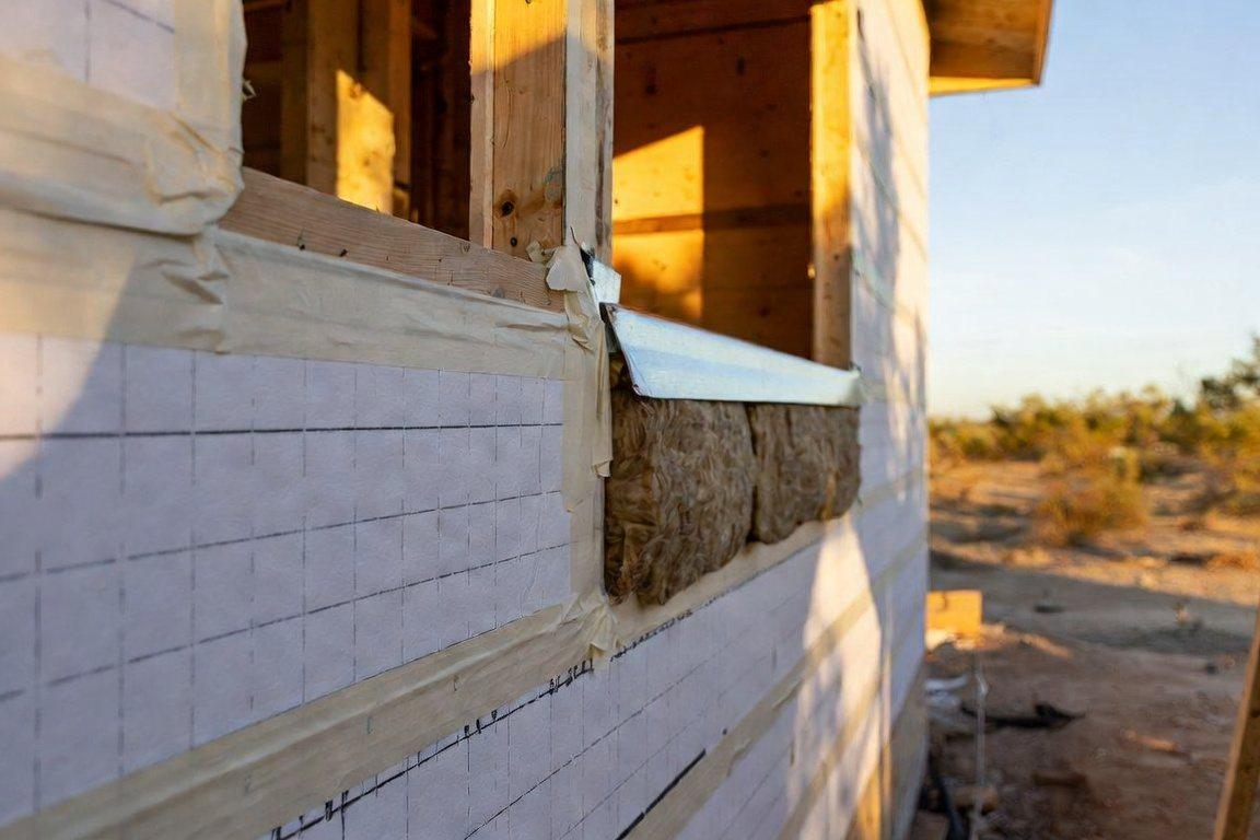 High-performance wall assembly with exterior insulation, air barrier and rainscreen