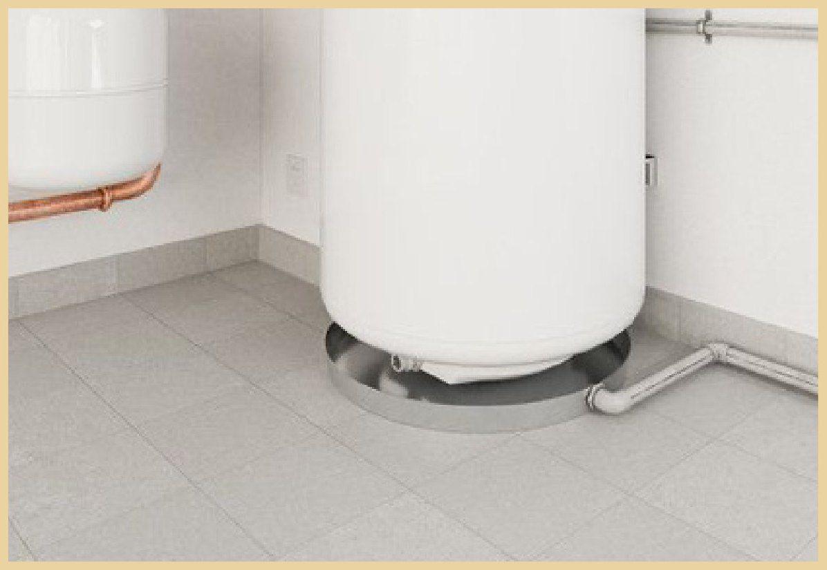 Water heater on a drain pan with a clean tiled floor
