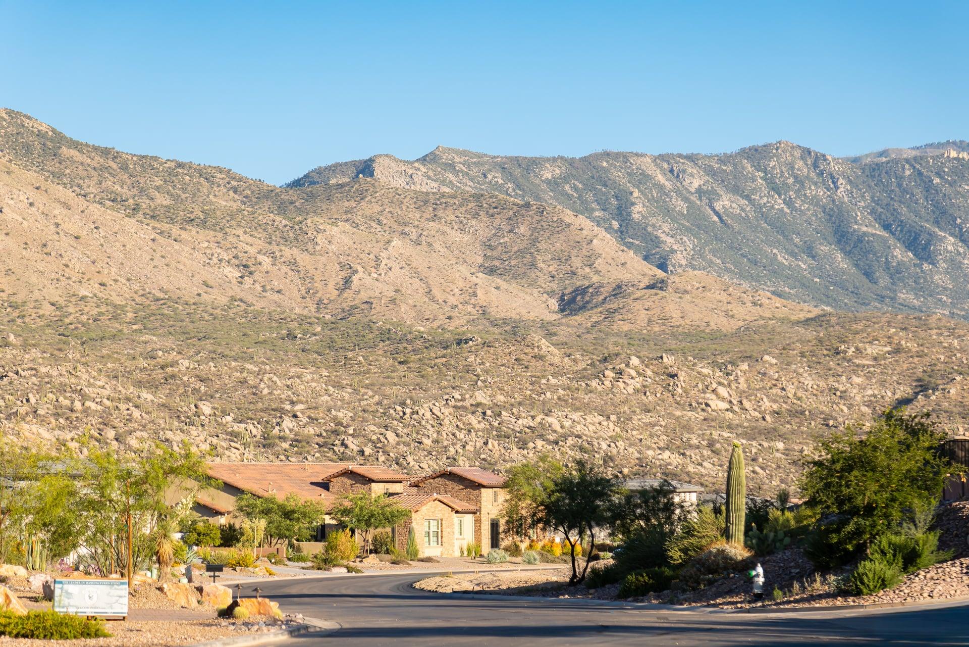 Entry road to the ELEMENT by SENERGY360 land with mountains beyond