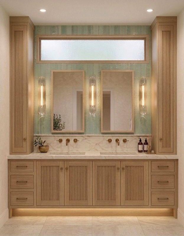 Upgraded Jack and Jill bathroom with fluted wood cabinetry and wall-mounted faucets