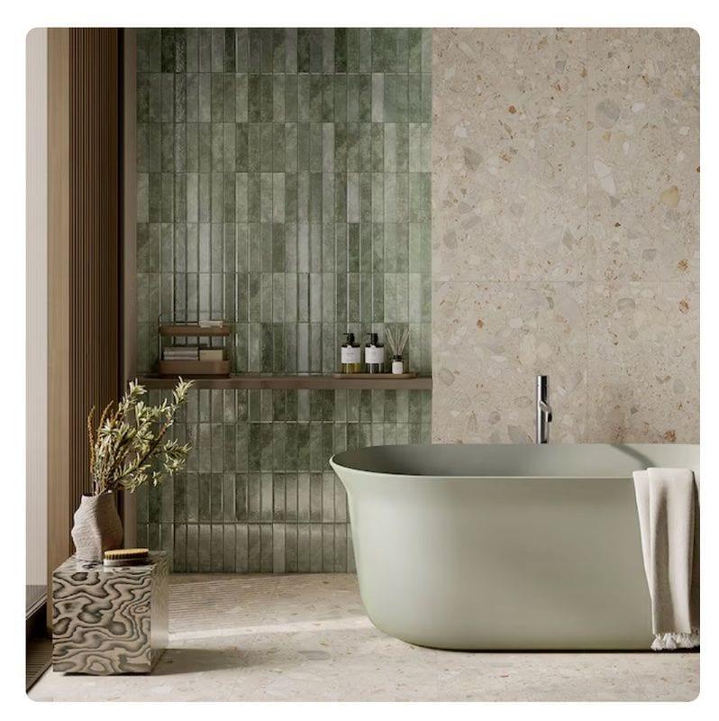 Silica-free stone tub with green Zellige tile wall