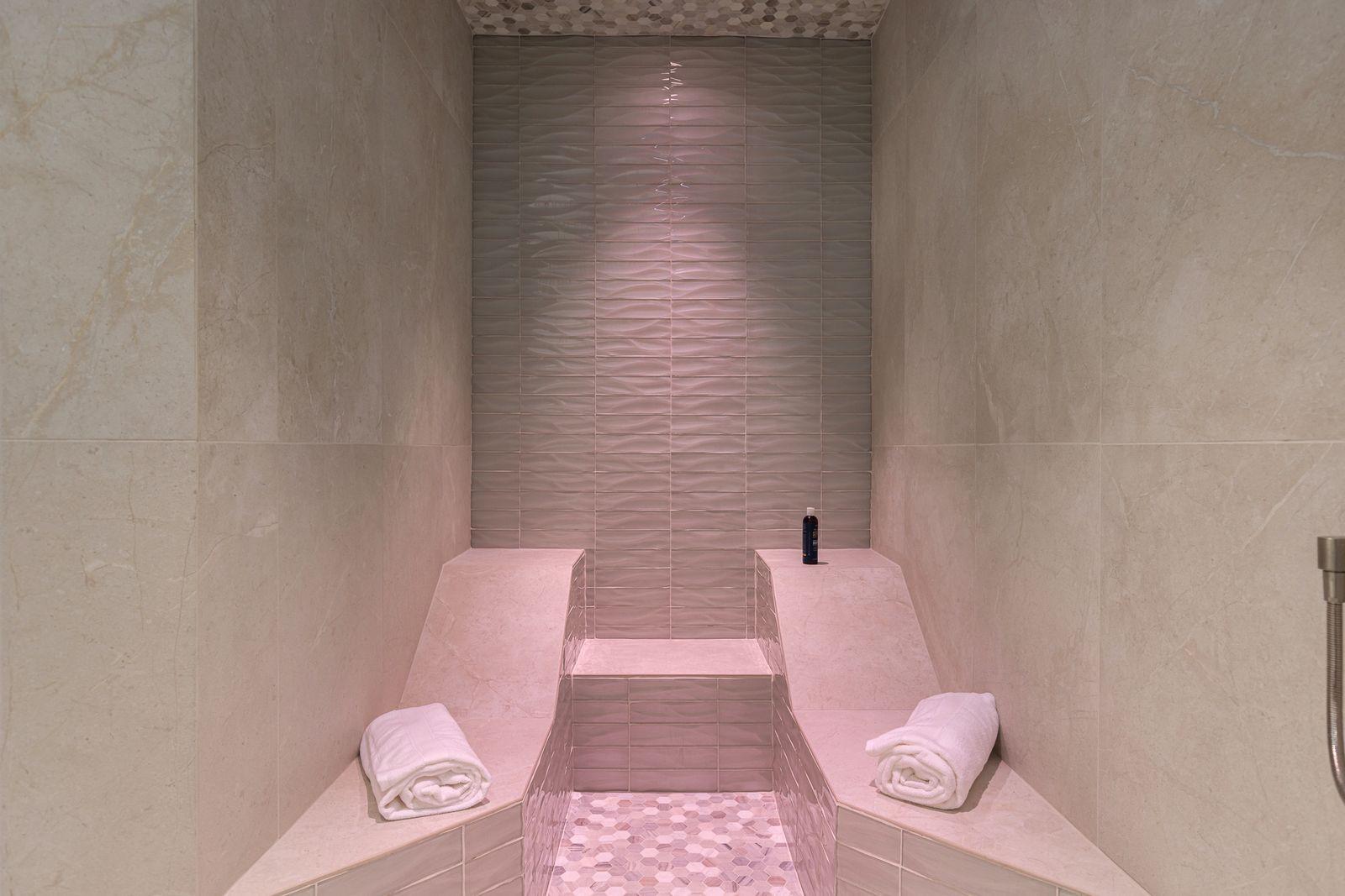 Tiled steam shower with a built-in bench