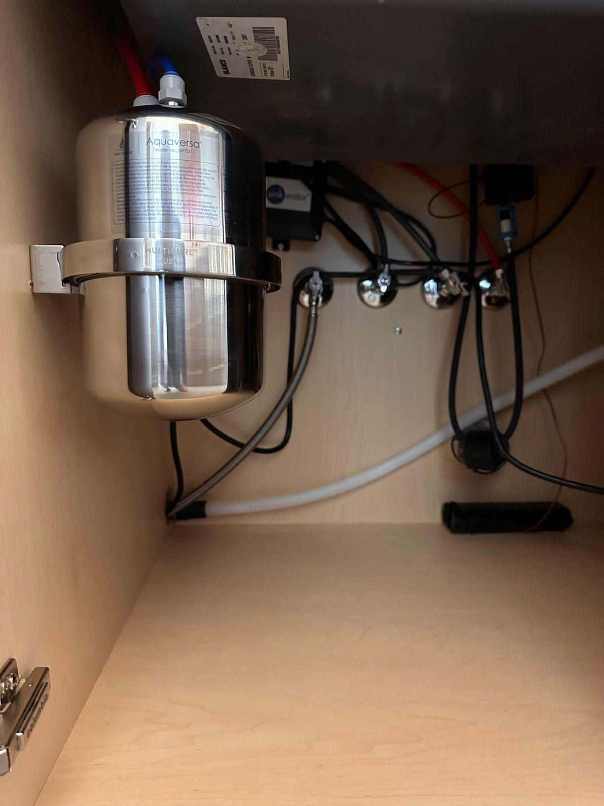 Stainless point-of-use filter mounted under a sink
