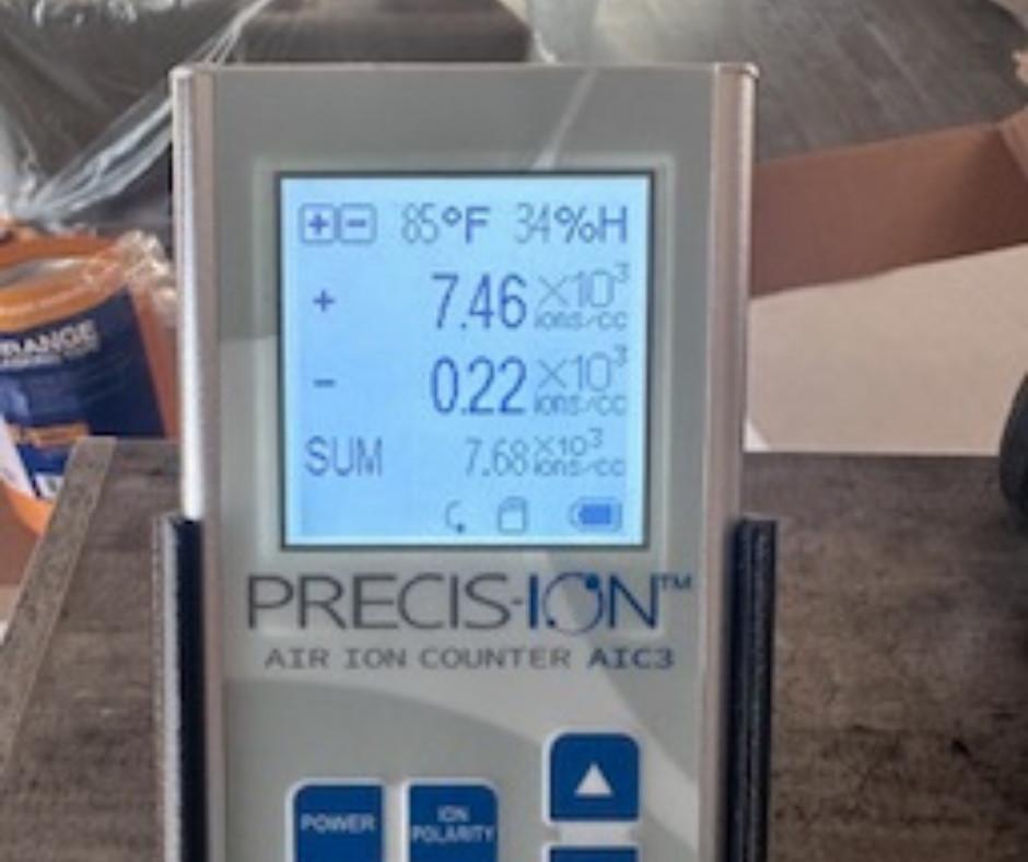 Precision-Ion AIC3 air ion counter showing positive and negative ion readings