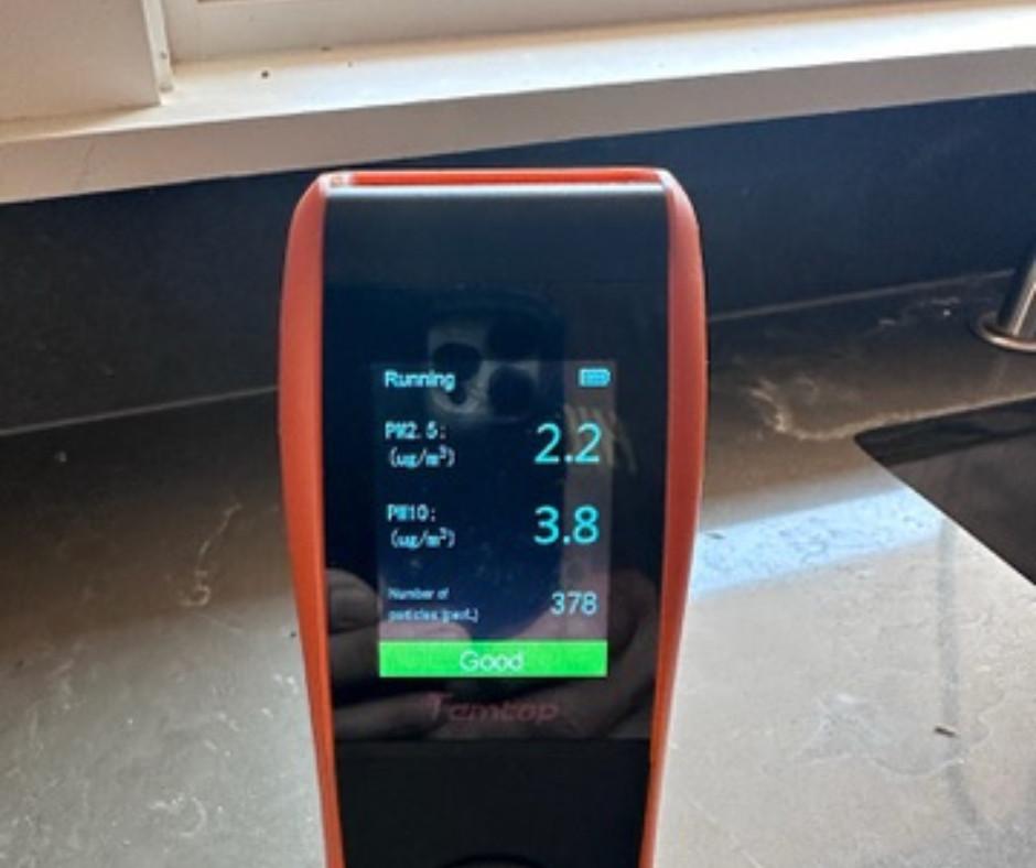 Temtop air quality monitor reading PM2.5 2.2 and PM10 3.8 micrograms per cubic meter, rated Good
