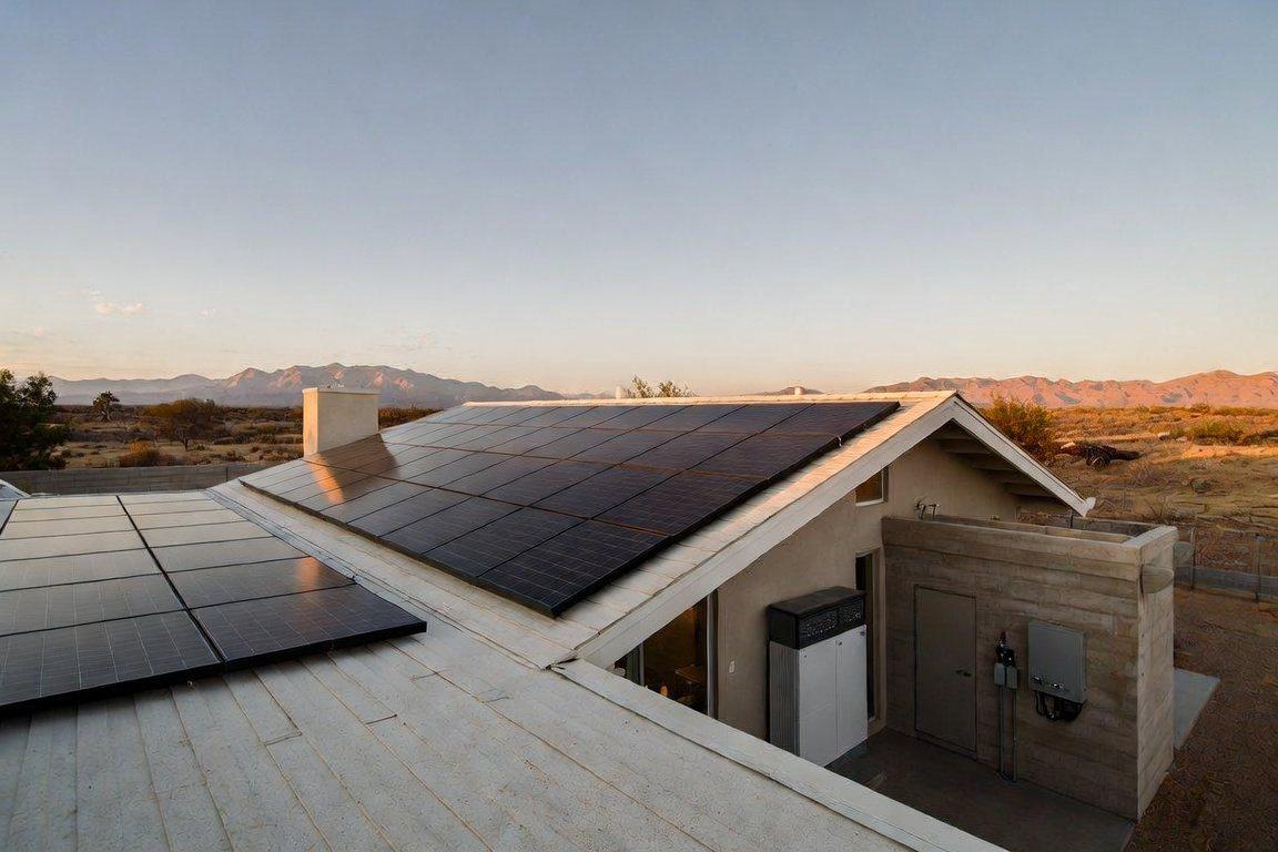 Desert-modern home with an integrated solar array and battery storage