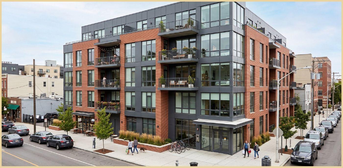 Brick and glass apartment building on a city street