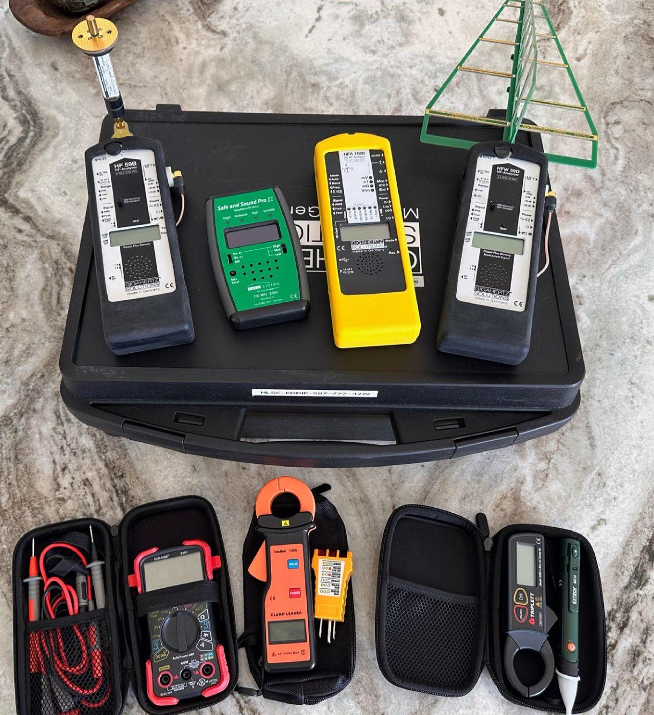Kit of indoor environmental meters and probes laid out in a case