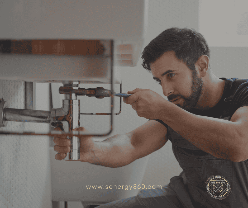 Plumber fixing water leak