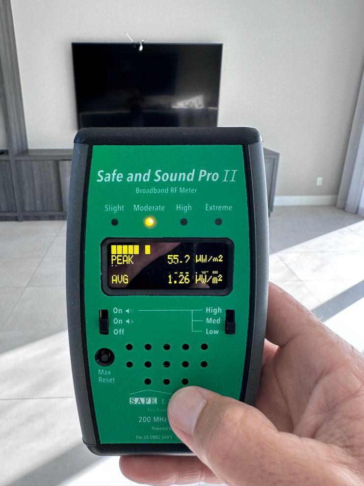 Safe and Sound Pro II broadband RF meter reading 55.7 peak and 1.26 average microwatts per square meter