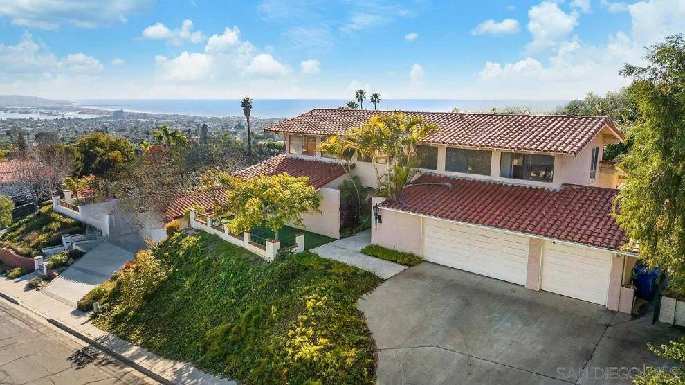 San Diego, CA: coastal home with a red tile roof and ocean view, inspected by SENERGY360 during a remodel