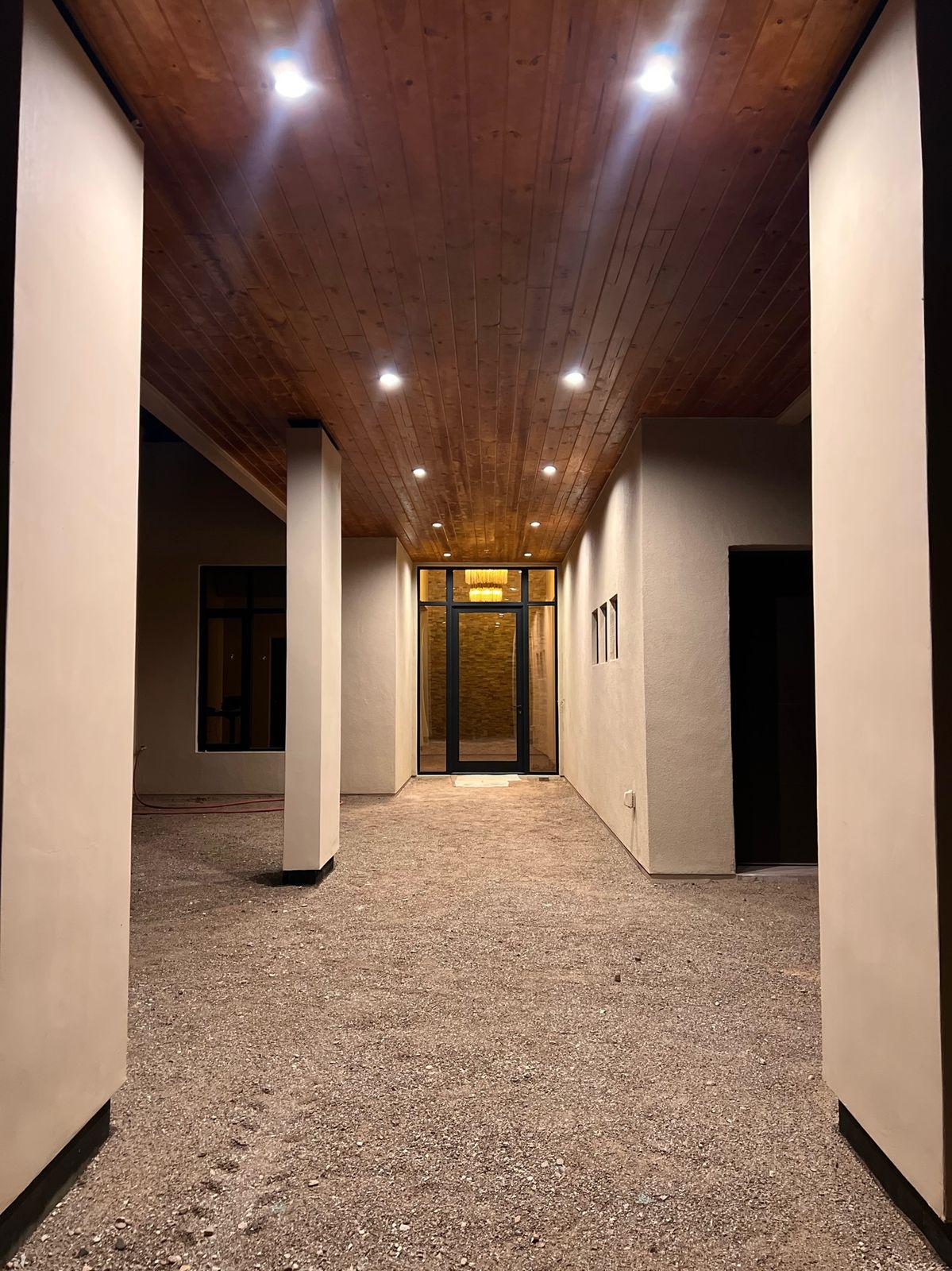 Hallway with a wood ceiling