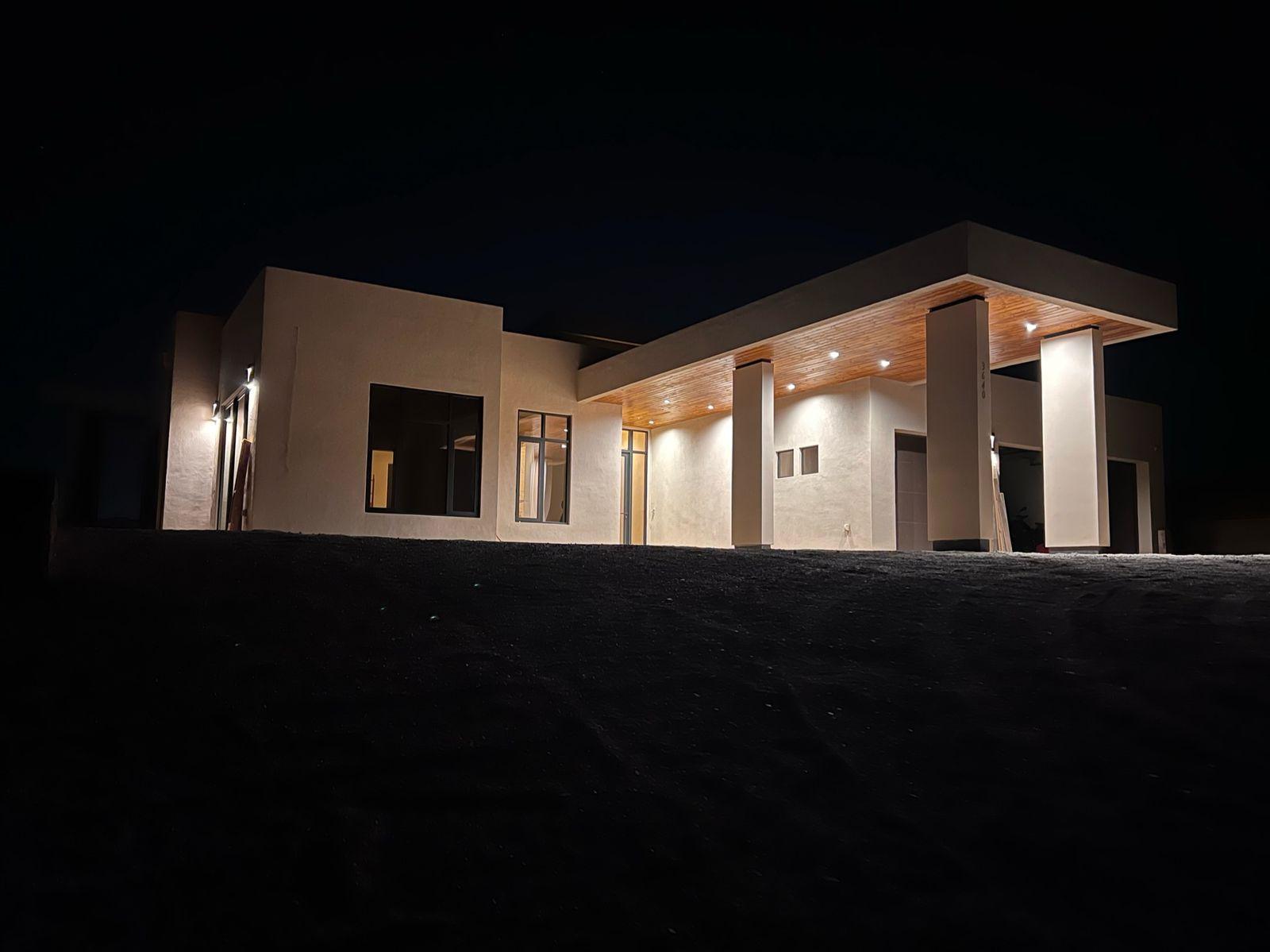 The house lit at night