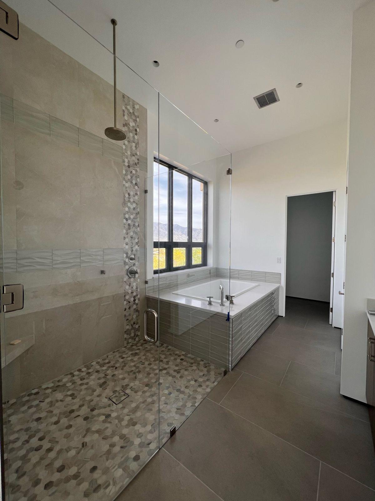 Walk-in shower with a pebble floor