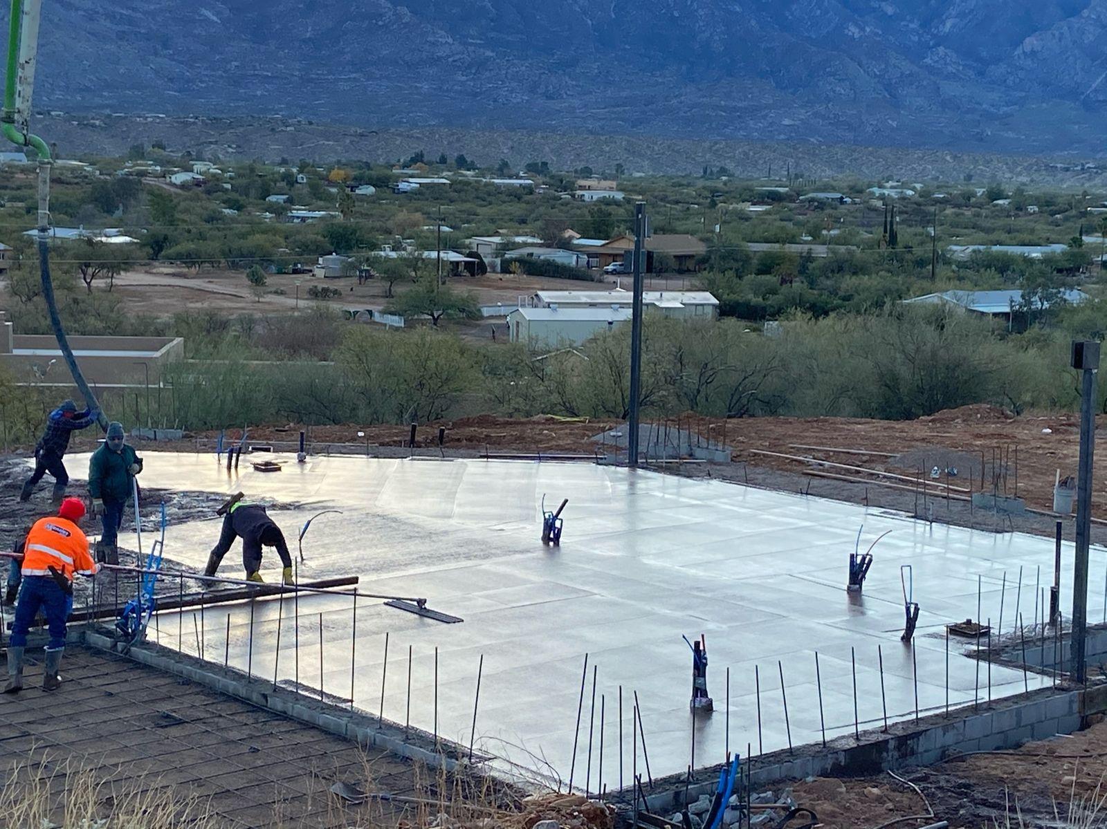Concrete being placed across the slab