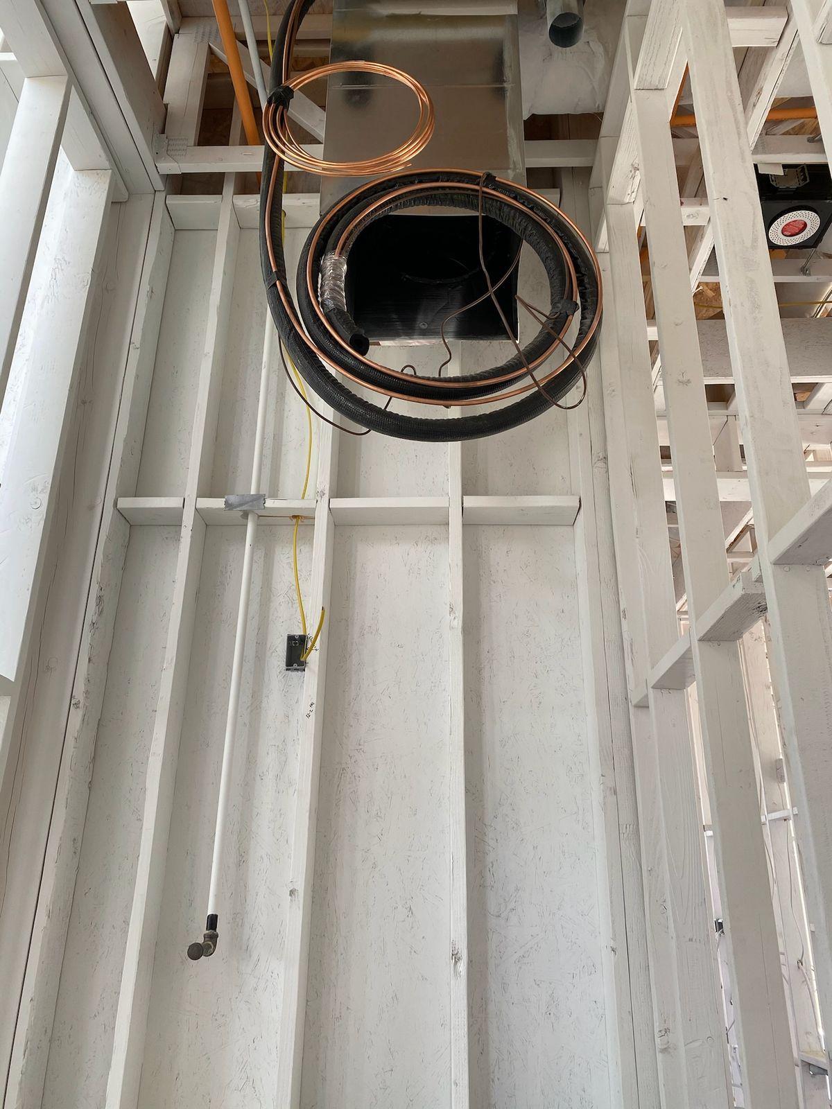 HVAC refrigerant lines and ductwork roughed in