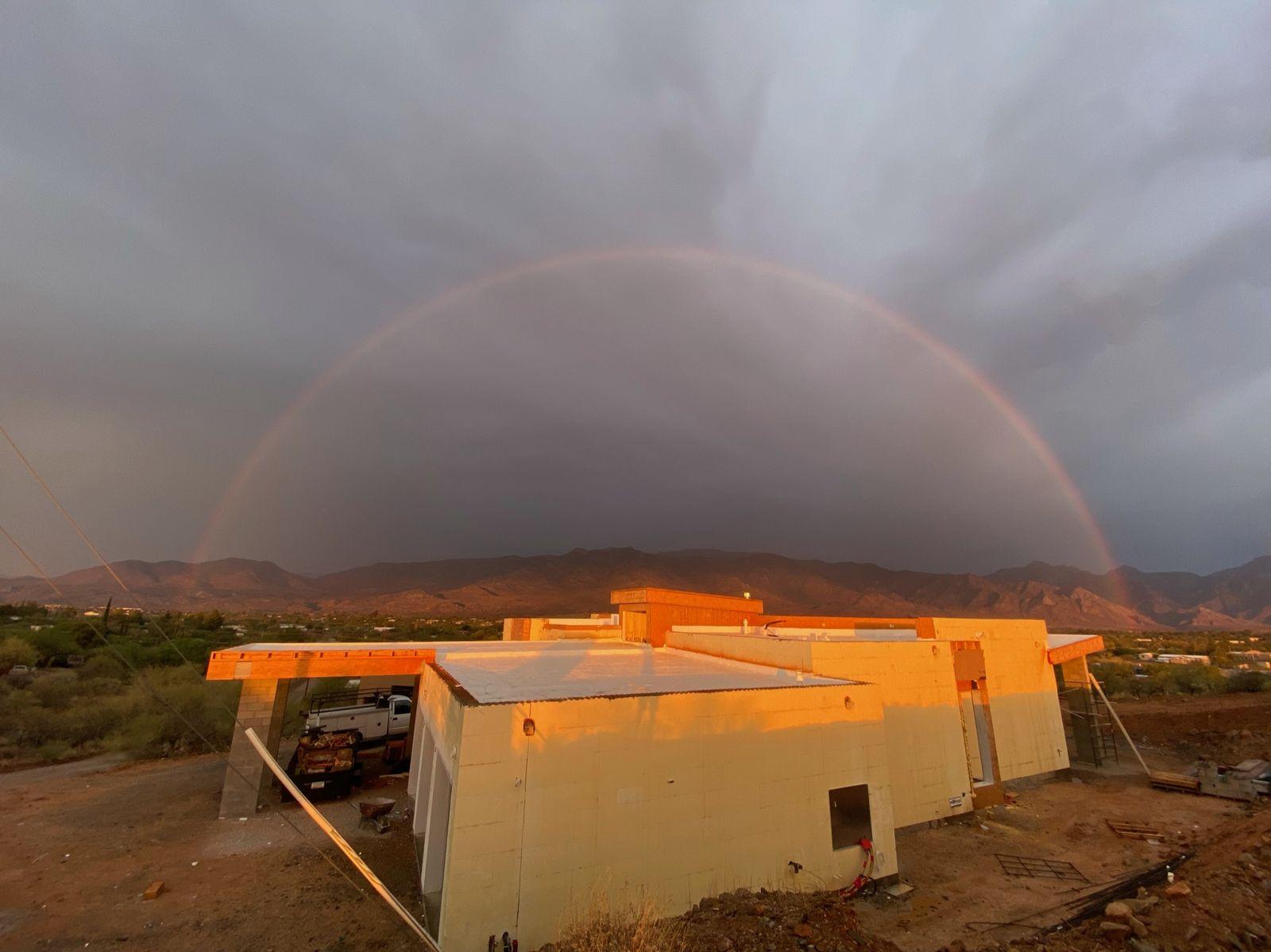 Rainbow over the house under construction