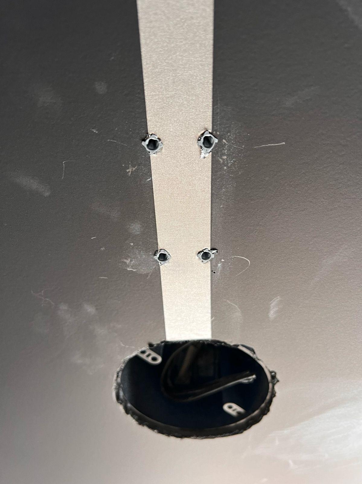 Grounding tape at a ceiling fixture box