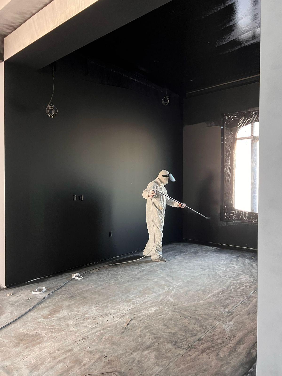 Painter spraying the shielding coat