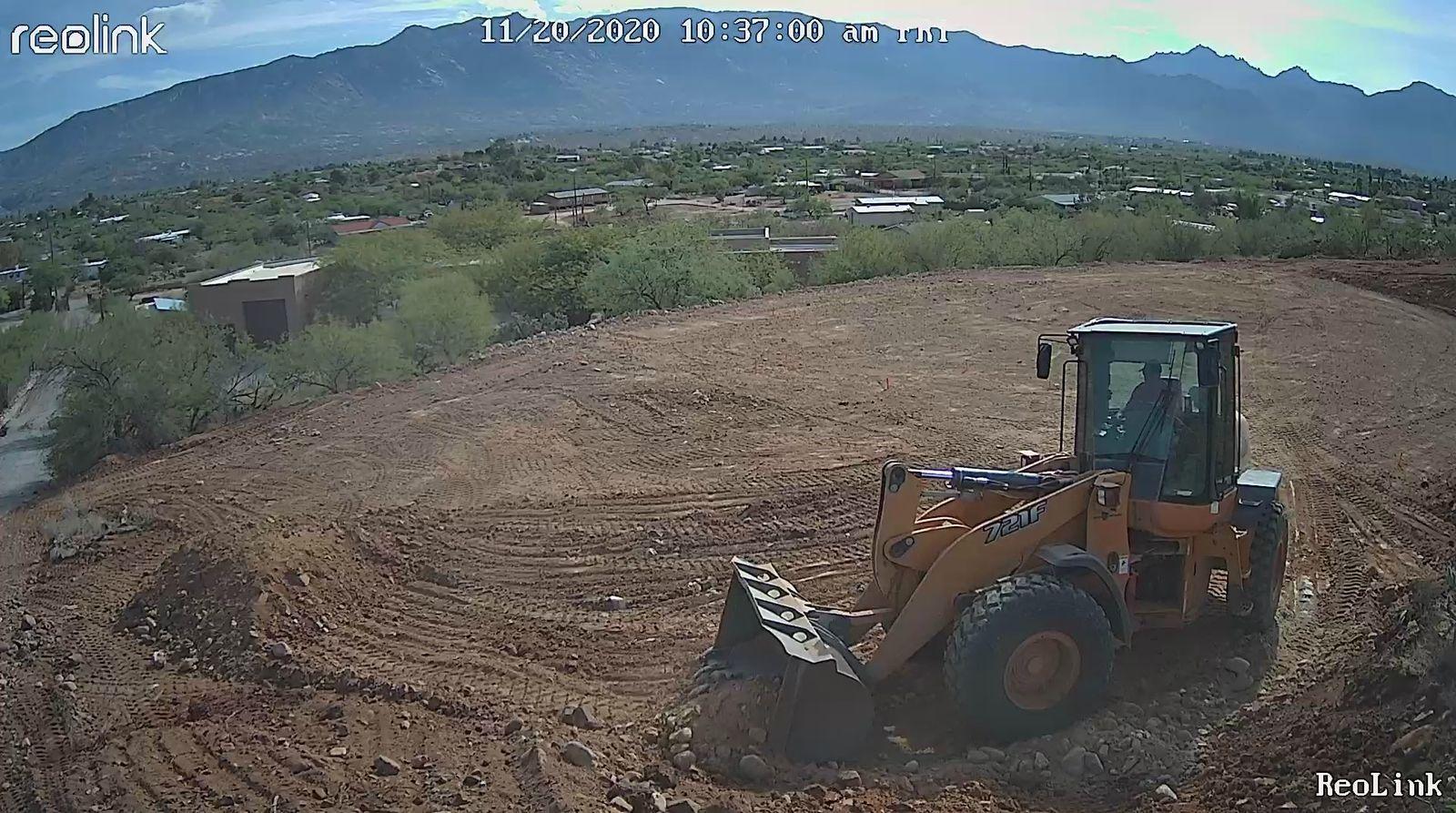 Loader grading the building pad