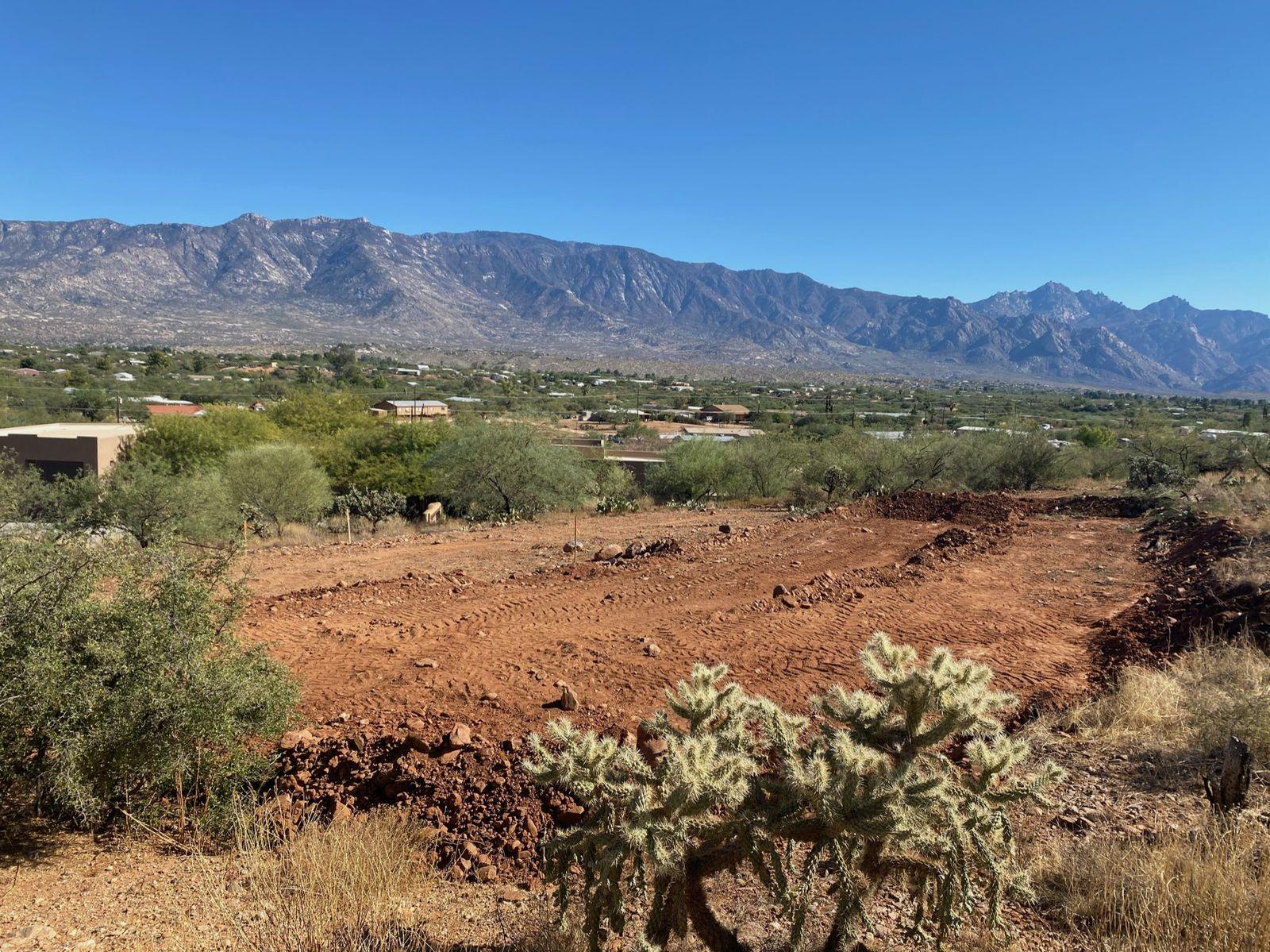 Cleared building pad with the mountains in the distance
