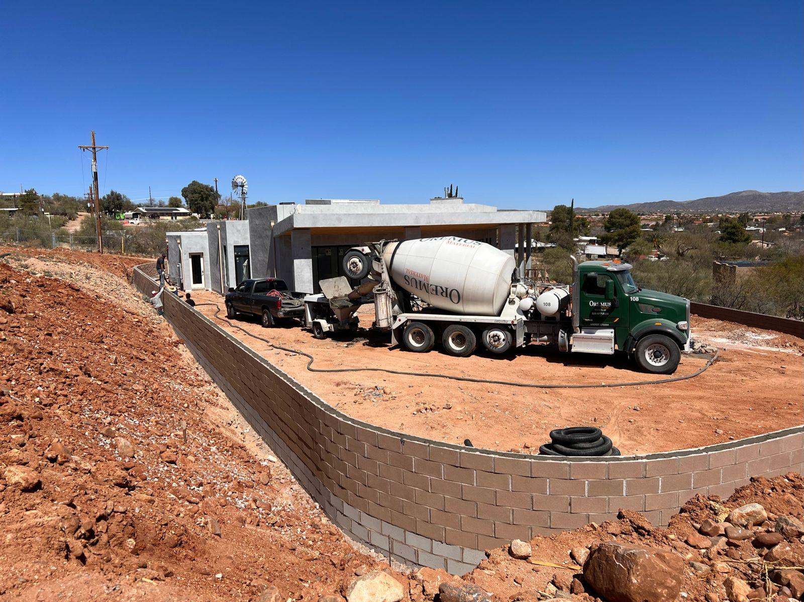 Concrete truck pouring the retaining wall
