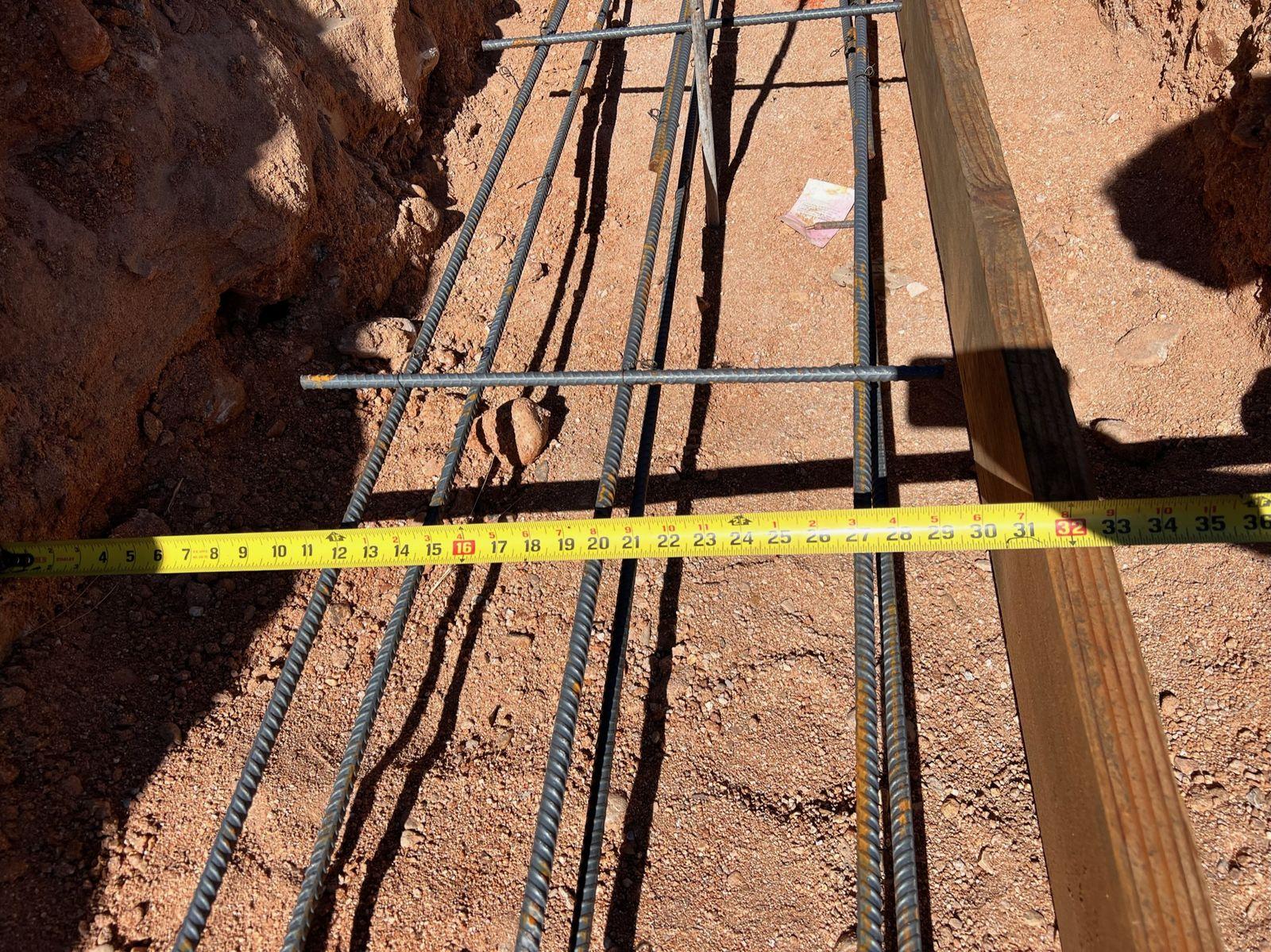 Utility trench with conduit, measured