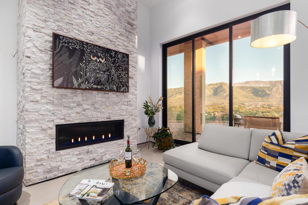 Great room with stacked-stone fireplace wall, linear fireplace, and floor-to-ceiling glass to the mountains